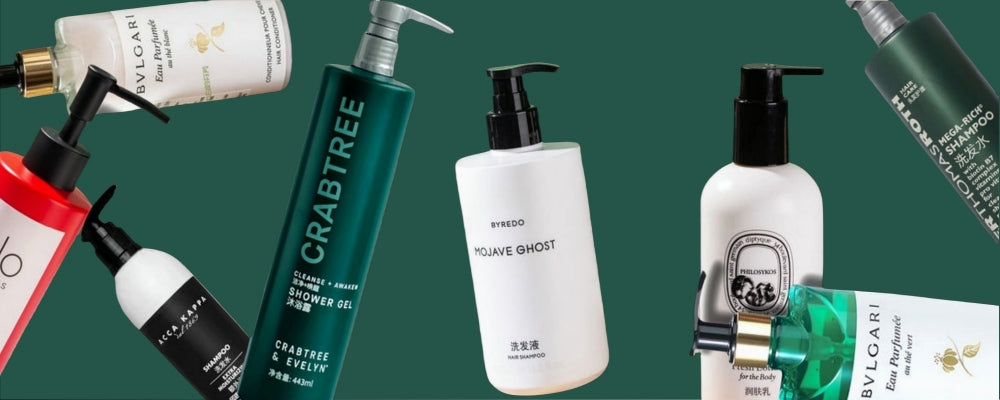 Seven bottles of hotel toiletries of different brands