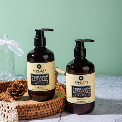 two bottles of APPELLES shampoo and conditioner.